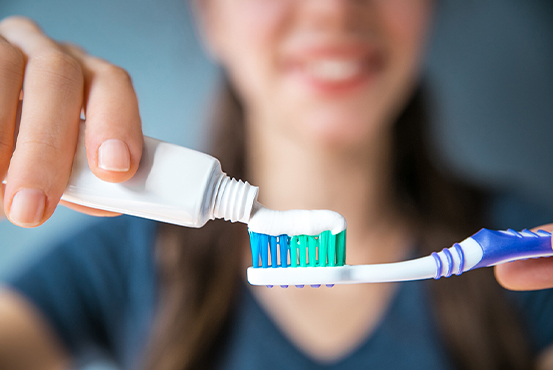 toothpaste on toothbrush